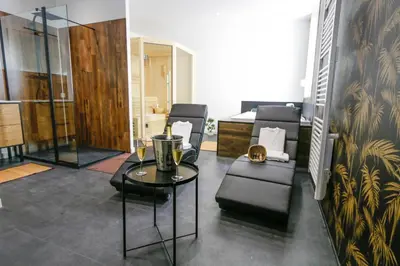 Coin salon dans l'établissement Suite Spa Privatif