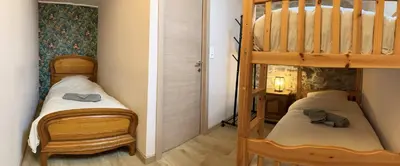 Un ou plusieurs lits dans un hébergement de l'établissement Le Gîte au bord de la Forêt