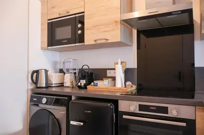Cuisine ou kitchenette dans l'établissement Chouette appartement près de l'Arena et de la Gare Centre de Reims