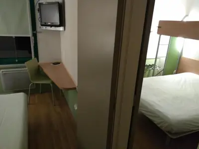 Un ou plusieurs lits dans un hébergement de l'établissement Hôtel Inn Design Laon
