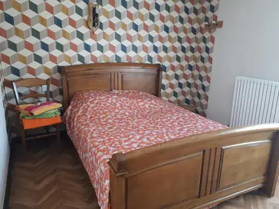 Un ou plusieurs lits dans un hébergement de l'établissement DEUX CHAMBRES DANS UNE MAISON INDIVIDUELLE AU COEUR De L AVESNOIS