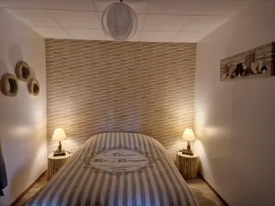 Un ou plusieurs lits dans un hébergement de l'établissement Gîte domaine de la galopade