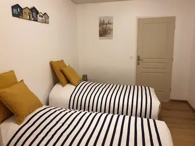 Un ou plusieurs lits dans un hébergement de l'établissement Gîte domaine de la galopade