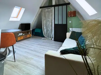 Télévision ou salle de divertissement dans l'établissement Le Perchoir