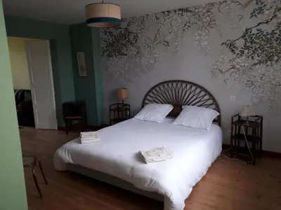 Un ou plusieurs lits dans un hébergement de l'établissement Gîte Tante Aurore et chambres d'Hôtes