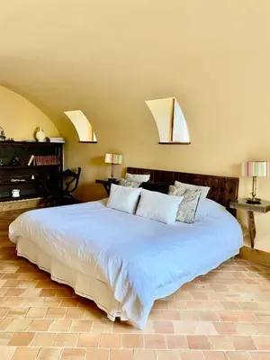 Un ou plusieurs lits dans un hébergement de l'établissement La chambre des vignerons