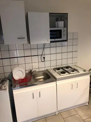 Cuisine ou kitchenette dans l'établissement La petite chambre sympa de Cindy