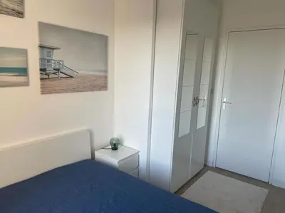 Un ou plusieurs lits dans un hébergement de l'établissement appartement neuf style architecte au calme