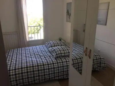 Un ou plusieurs lits dans un hébergement de l'établissement appartement neuf style architecte au calme