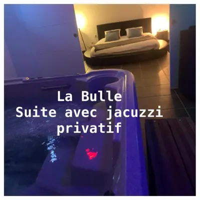 Un ou plusieurs lits dans un hébergement de l'établissement Aux Fines Bulles Chambres d hôtes