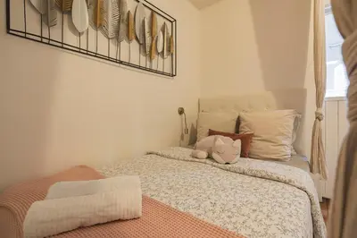 Un ou plusieurs lits dans un hébergement de l'établissement Appartement cosy proche Cathédrale