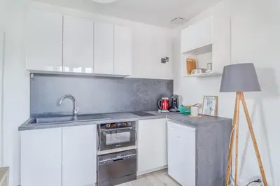 Cuisine ou kitchenette dans l'établissement Le 12 - Freedomus Marne-la-Vallée