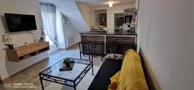 Télévision ou salle de divertissement dans l'établissement Appartement Cosy au cœur de la Champagne