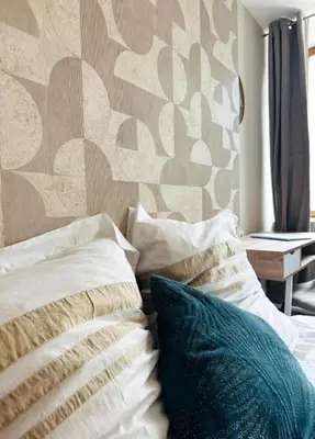Un ou plusieurs lits dans un hébergement de l'établissement appartement chic