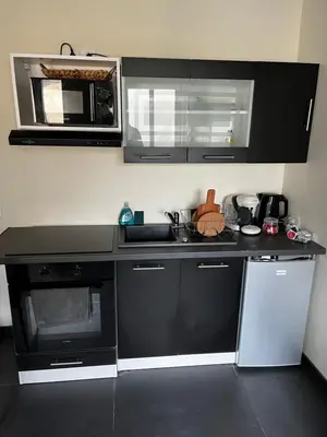 Cuisine ou kitchenette dans l'établissement Magnifique Duplex avec Jaccuzi, Sauna et Cinema Room Privatif