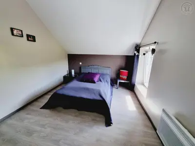 Un ou plusieurs lits dans un hébergement de l'établissement Gîte spacieux avec jardin clos et dortoir à Liessies - FR-1-510-162