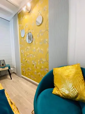 Coin salon dans l'établissement L'ESCAPADE
