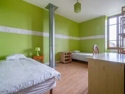 Un ou plusieurs lits dans un hébergement de l'établissement Vintage Holiday Home in Nouart
