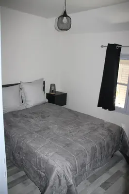 Un ou plusieurs lits dans un hébergement de l'établissement Les appartements du Saint Hubert