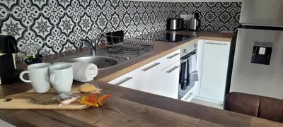 Cuisine ou kitchenette dans l'établissement Cottage Interieur Spa classé 4 étoiles - balnéo et sauna privatif
