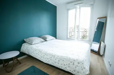 Un ou plusieurs lits dans un hébergement de l'établissement **La Kreolita** near Paris / Disneyland Paris