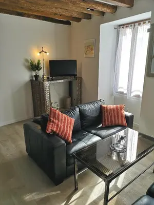 Coin salon dans l'établissement Cottage AU TERMINUS 3 climatisé