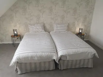 Un ou plusieurs lits dans un hébergement de l'établissement Cottage AU TERMINUS 3 climatisé