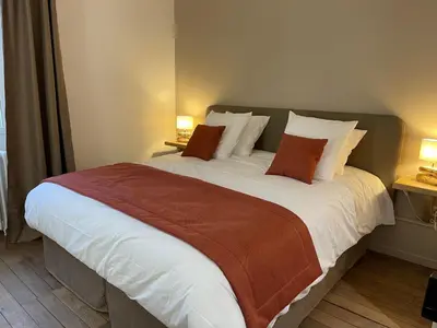 Un ou plusieurs lits dans un hébergement de l'établissement Domaine Des Loches ****