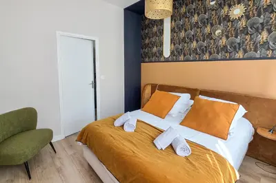 Un ou plusieurs lits dans un hébergement de l'établissement Les Appartements de la Nef d'Or