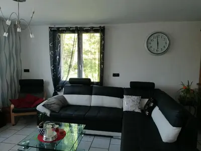 Coin salon dans l'établissement Maison de campagne à Balaives et Butz