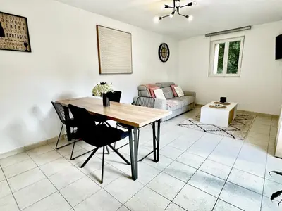 Coin salon dans l'établissement Le Cubry : Appart hyper-centre avec une place de parking
