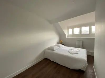 Un ou plusieurs lits dans un hébergement de l'établissement Hyper centre - Cathédrale 2 chambres