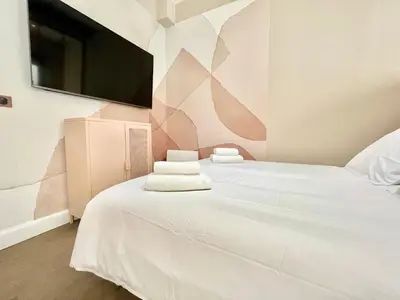 Un ou plusieurs lits dans un hébergement de l'établissement Suite Monceau - Reims