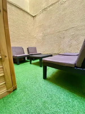 Coin salon dans l'établissement Suite Romain, appartement en centre ville