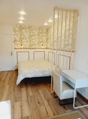 Un ou plusieurs lits dans un hébergement de l'établissement Superbe Appartement en plein centre-ville de Crépy