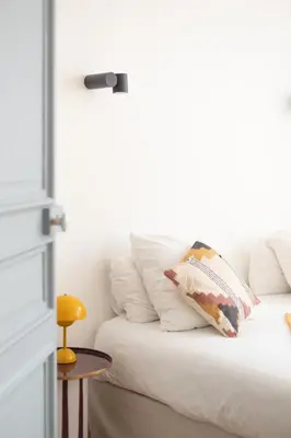 Un ou plusieurs lits dans un hébergement de l'établissement Les Appartements Porte Mars Reims Gare Centre