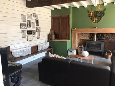 Coin salon dans l'établissement Villa Verger vakantiewoning 12 personen