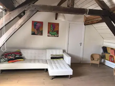 Coin salon dans l'établissement Villa Verger vakantiewoning 12 personen