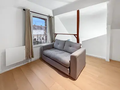 Coin salon dans l'établissement Évasion détente avec Jacuzzi Sauna & Billard