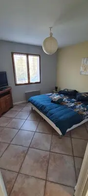 Un ou plusieurs lits dans un hébergement de l'établissement CHALET ANTLANA maison chaleureuse