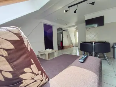 Télévision ou salle de divertissement dans l'établissement Gite BA 3
