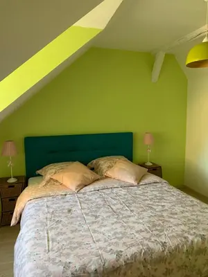 Un ou plusieurs lits dans un hébergement de l'établissement LA VILLA CAPUCINE