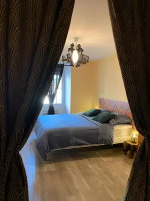 Un ou plusieurs lits dans un hébergement de l'établissement LA VILLA CAPUCINE