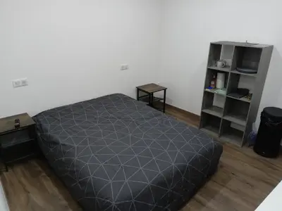 Un ou plusieurs lits dans un hébergement de l'établissement Chambre indépendante en plein centre Ville