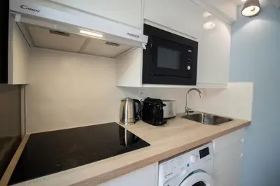 Cuisine ou kitchenette dans l'établissement Self Checkin Automatique - Downtown - ANTARCTIQUE