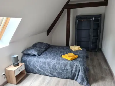 Un ou plusieurs lits dans un hébergement de l'établissement Aux remparts du château