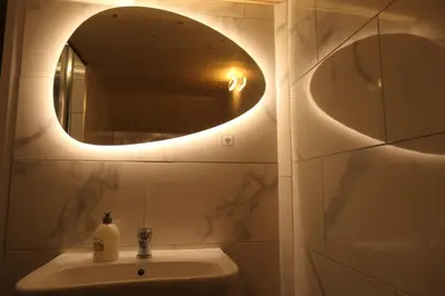 Salle de bains dans l'établissement Île aux Palmiers Appartement familial proche Disneyland
