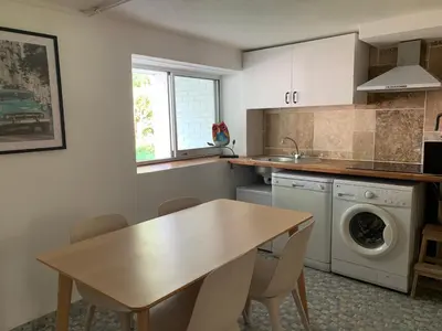 Cuisine ou kitchenette dans l'établissement Île aux Palmiers Appartement familial proche Disneyland