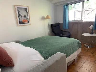 Un ou plusieurs lits dans un hébergement de l'établissement Île aux Palmiers Appartement familial proche Disneyland