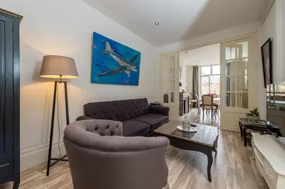 Coin salon dans l'établissement Suites Mana - Bleu Pacifique - Vue sur Place Ducale avec Parking privé inclus